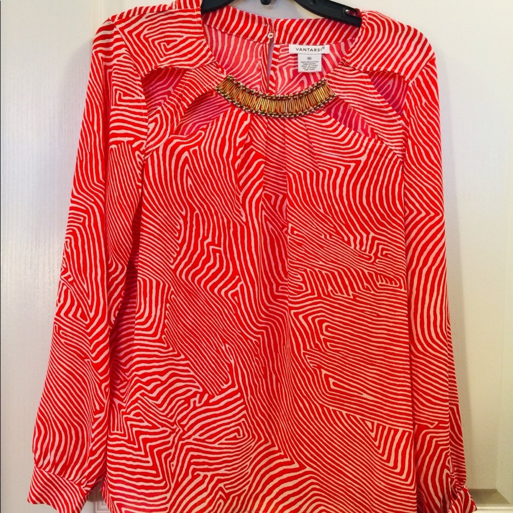 Long sleeve with a red cut out and attach bling